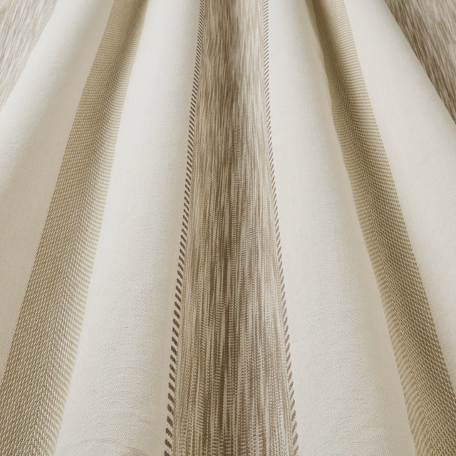Cream cotton fabric with broad wavy taupe stripes and fine woven texture