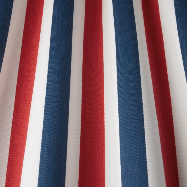 Vertical navy, red and ivory striped cotton fabric with a fine twill weave