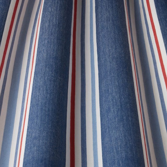 Vertical navy, white, pale blue and red striped cotton fabric