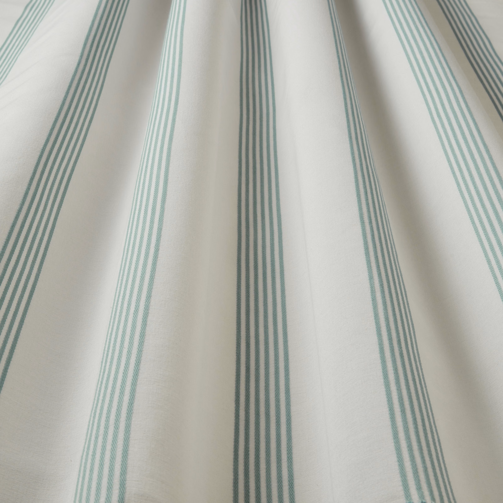Off-white cotton fabric with narrow aqua vertical stripes
