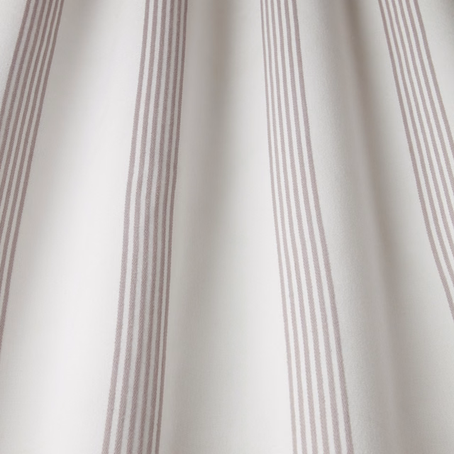 Pale cotton fabric with narrow mauve-grey vertical stripes on a creamy ground