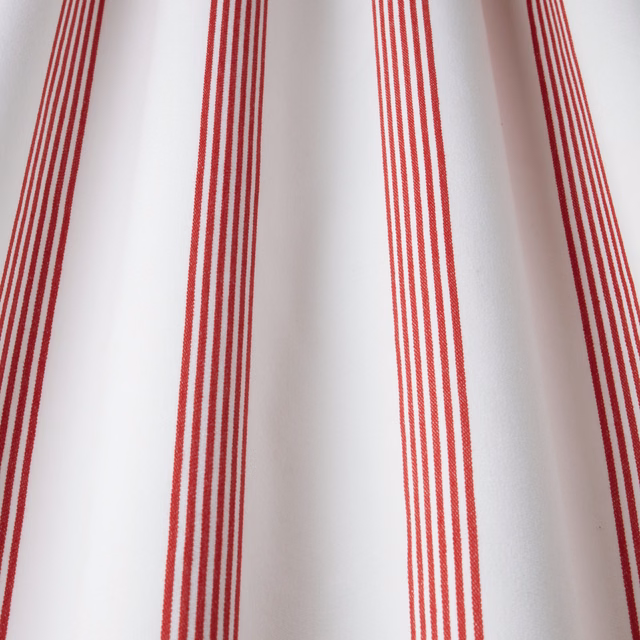 Red vertical pinstripe cotton fabric on a white ground, shown as a swatch