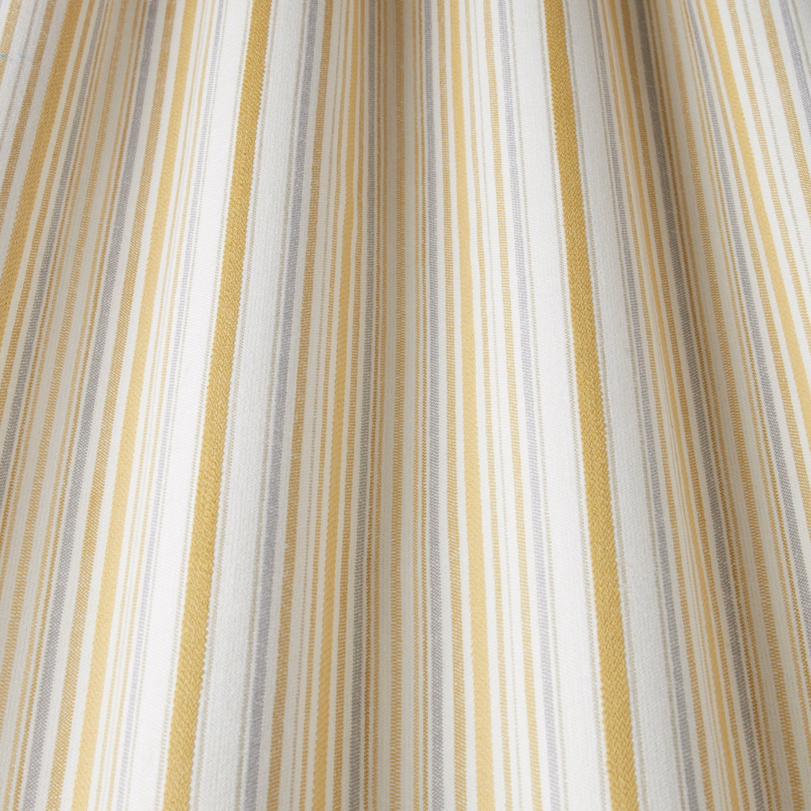 Cream and citrus yellow vertical striped cotton fabric with woven texture
