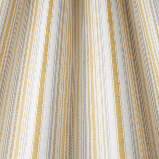 Cream and citrus yellow vertical striped cotton fabric with woven texture