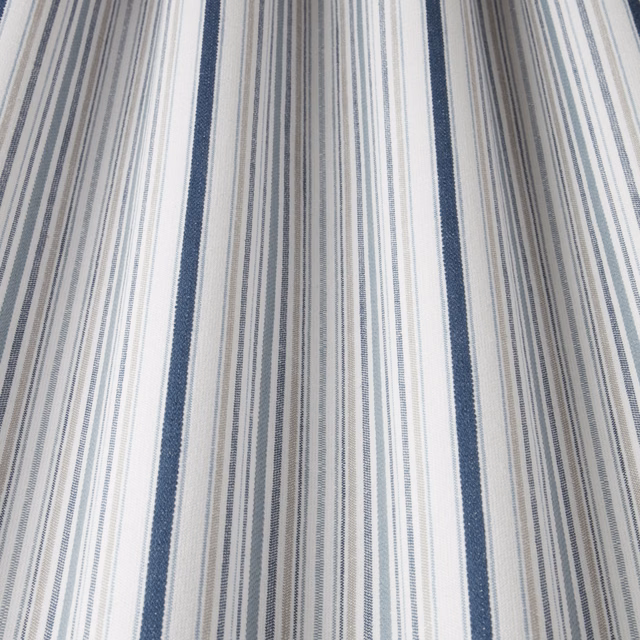Blue and white striped cotton fabric with narrow pinstripes and navy bands