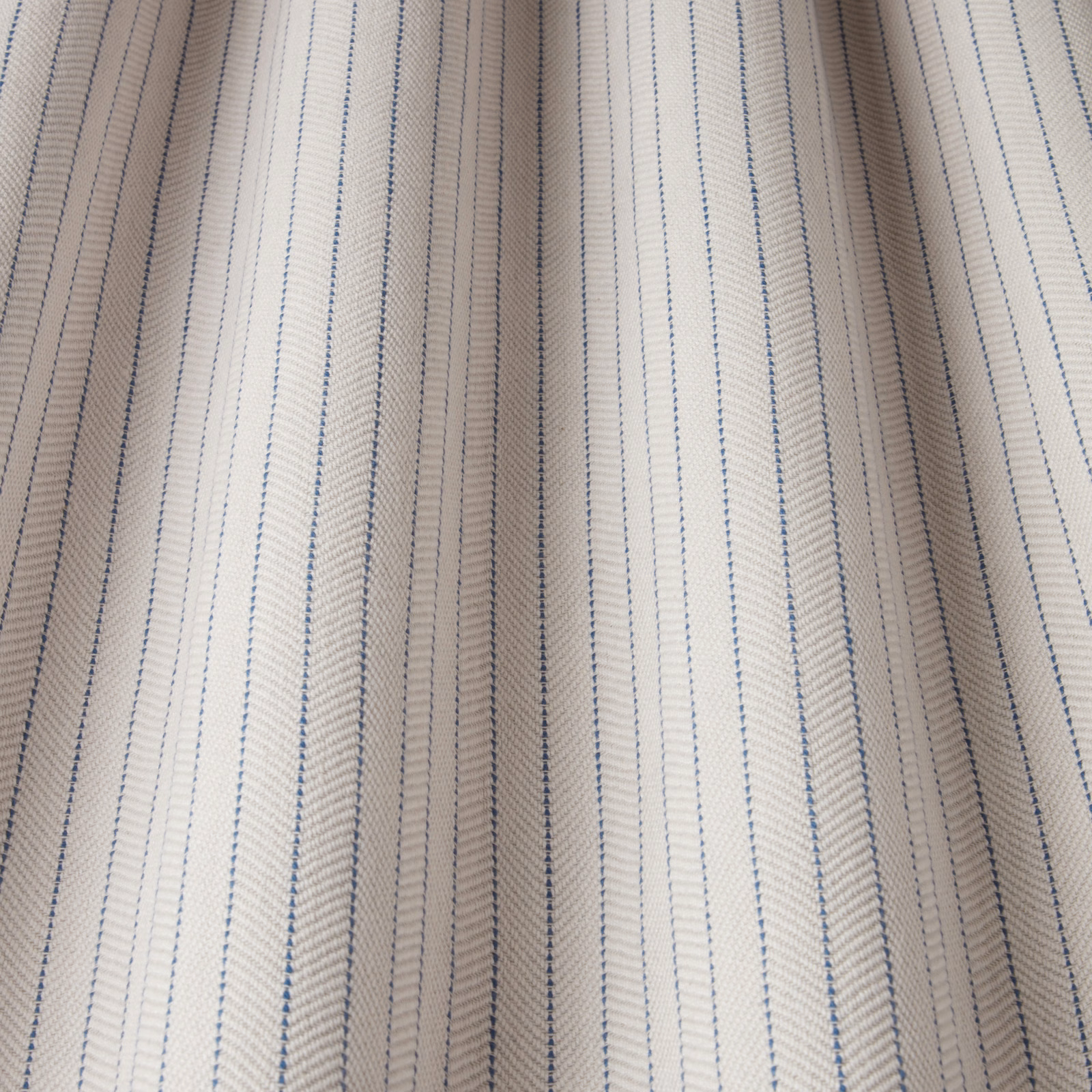 Cream cotton fabric with fine kingfisher blue pinstripes