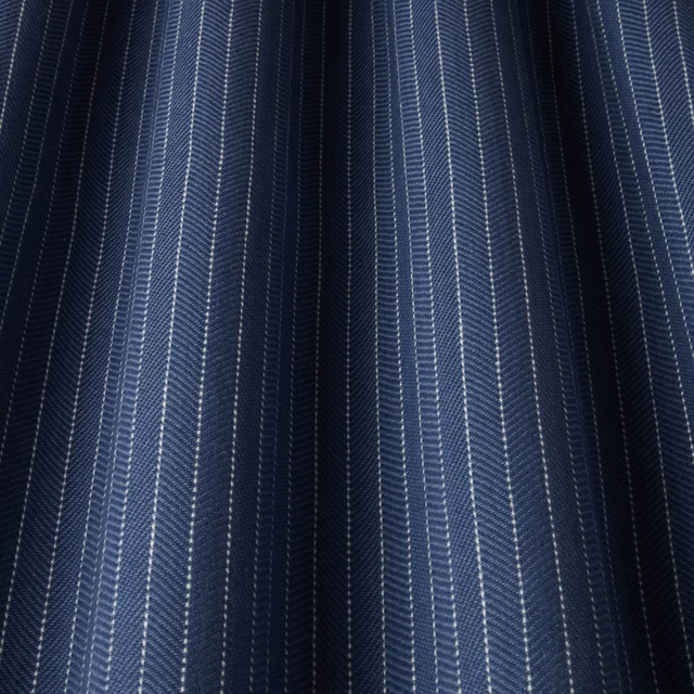 Dark navy cotton fabric with fine vertical pale blue and white stripes