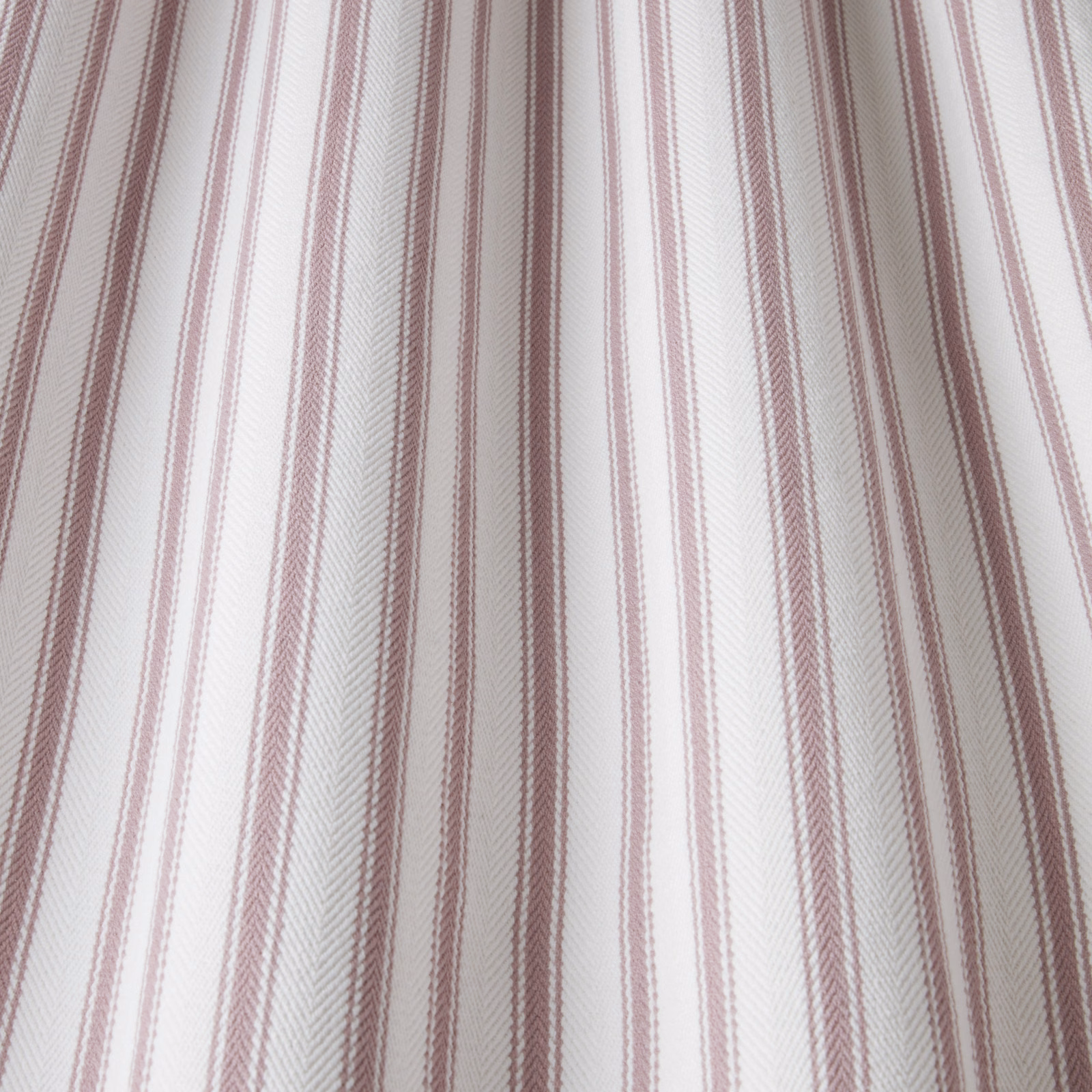 White cotton fabric with slim dusty rose wavy vertical stripes
