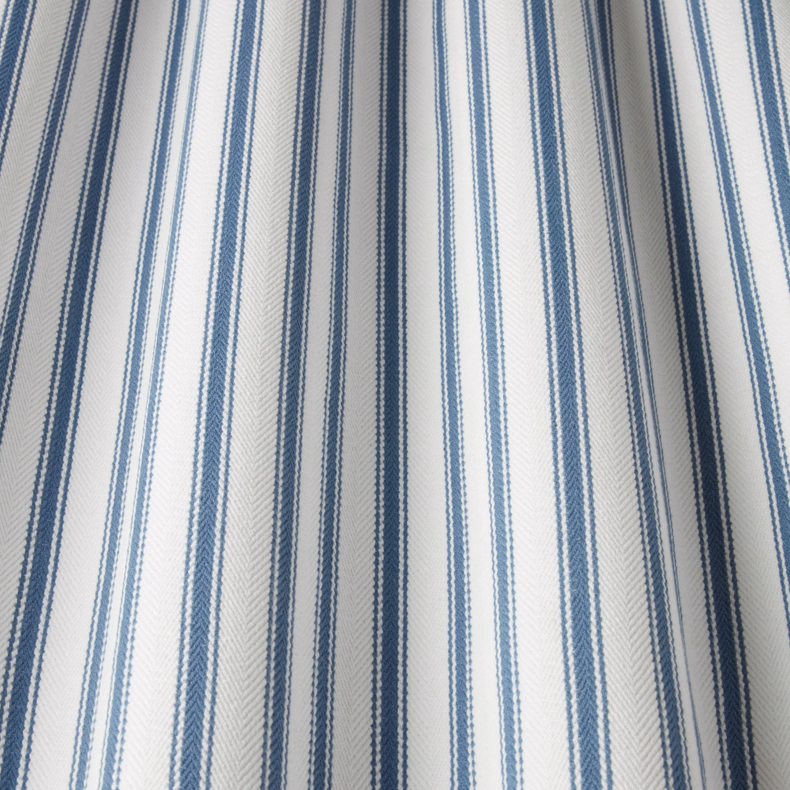 Blue and white vertical striped cotton fabric with herringbone texture