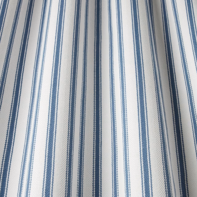 Blue and white vertical striped cotton fabric with herringbone texture