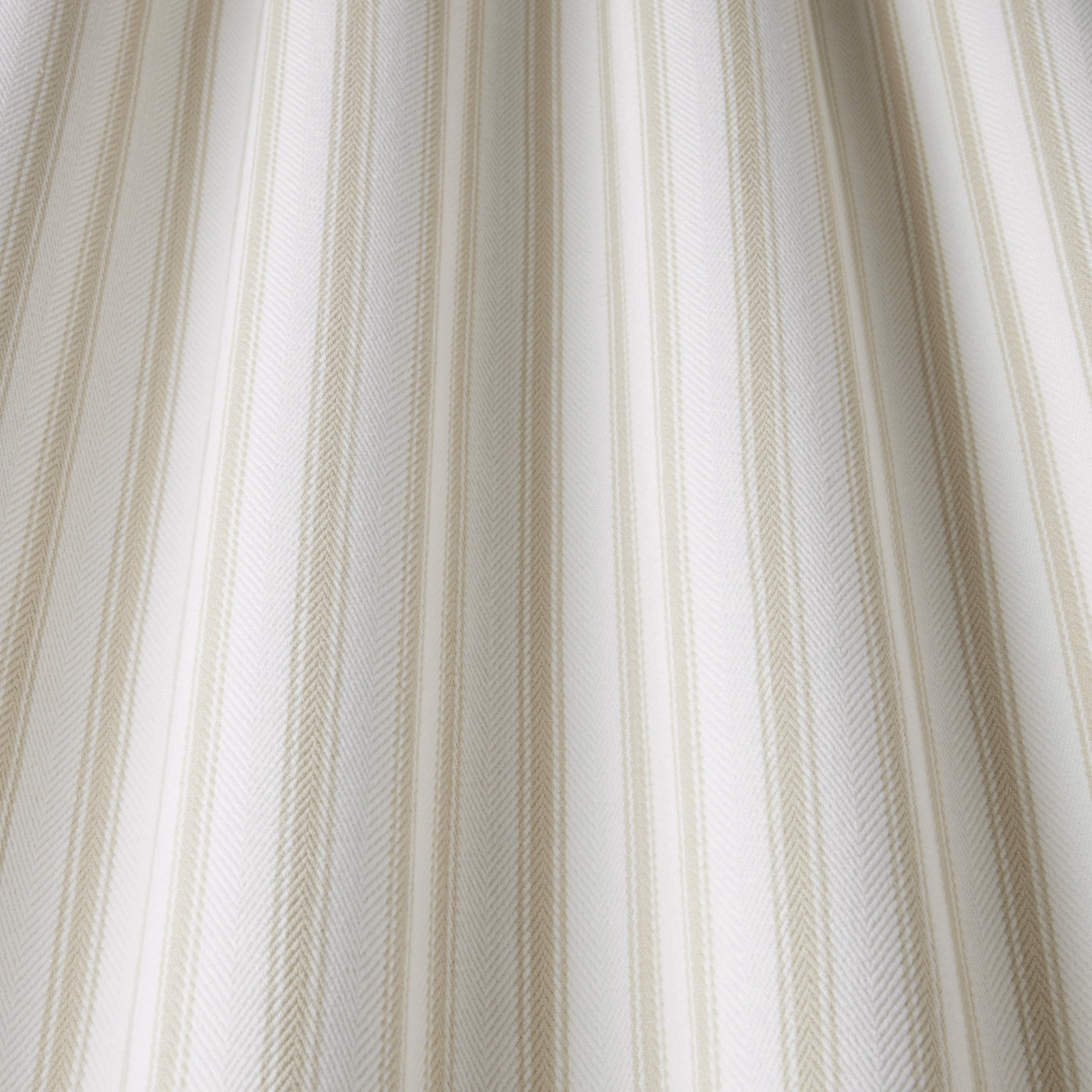 Pale cream cotton fabric with тонed wavy vertical stripe and fine woven texture