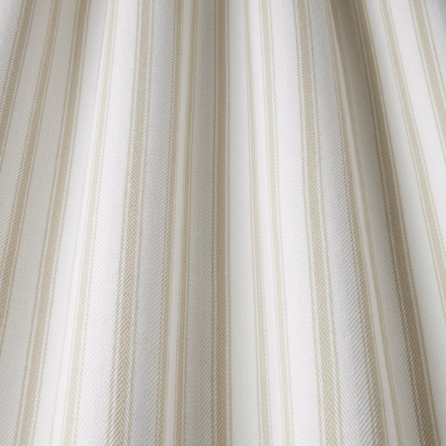 Pale cream cotton fabric with тонed wavy vertical stripe and fine woven texture