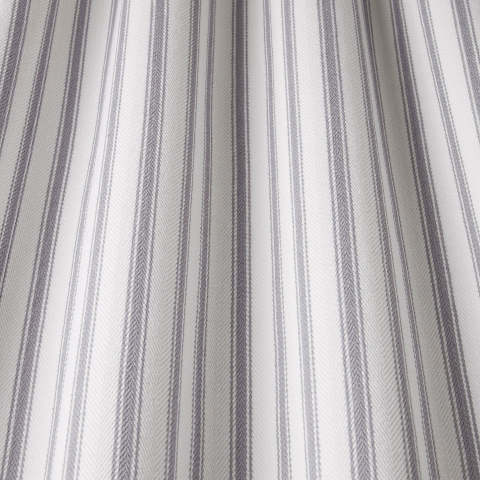Pale grey cotton fabric with fine wavy vertical stripes and soft texture