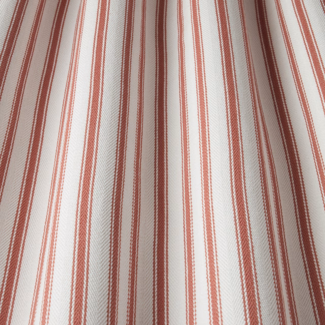 Cream cotton fabric with narrow raspberry vertical stripes and subtle herringbone weave