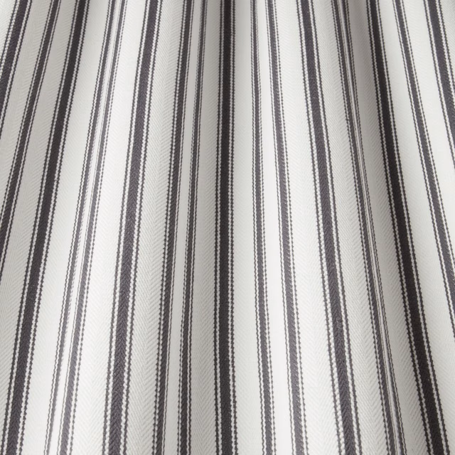 Off-white cotton fabric with narrow and broad wavy slate-grey stripes
