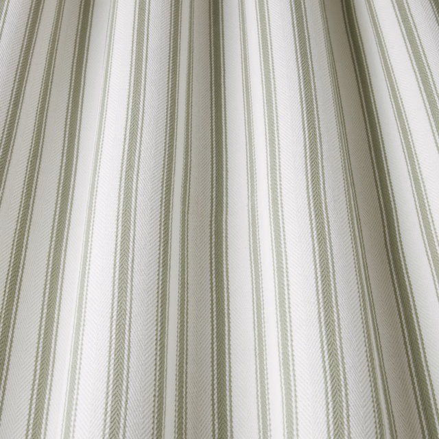 Pale cotton fabric with fine willow-green wavy vertical stripes