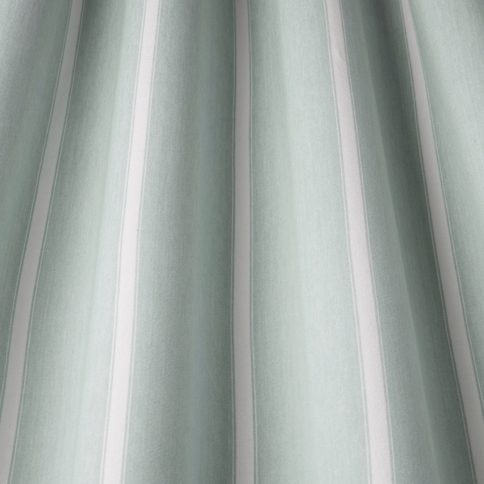 Soft aqua and white wavy striped cotton fabric with a subtle woven texture