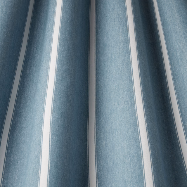 Blue and white wavy vertical stripe cotton fabric with soft sheen