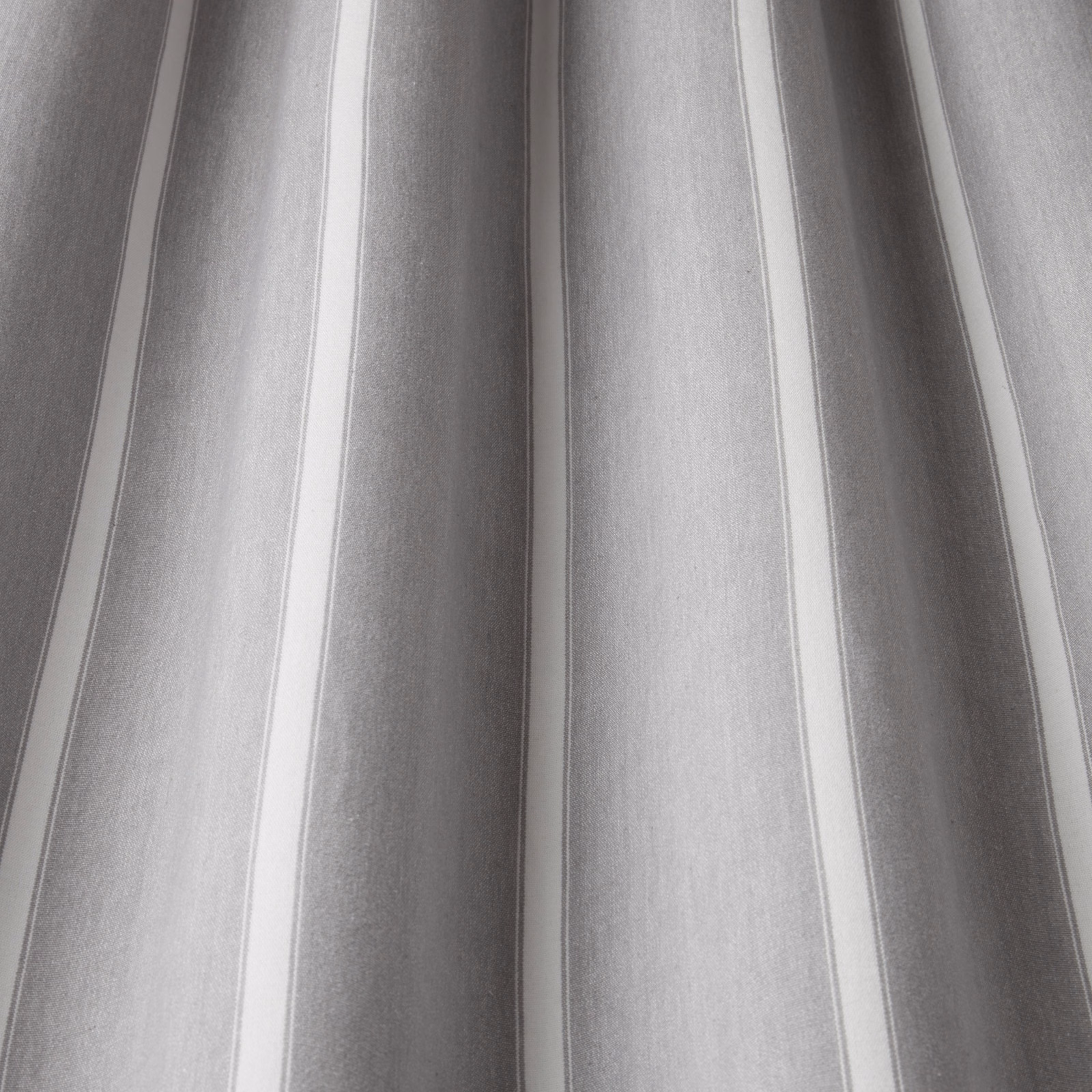 Soft grey and white wavy striped cotton fabric with a smooth woven texture