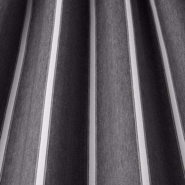 Slate grey and charcoal vertical stripes with slim pale bands on woven cotton