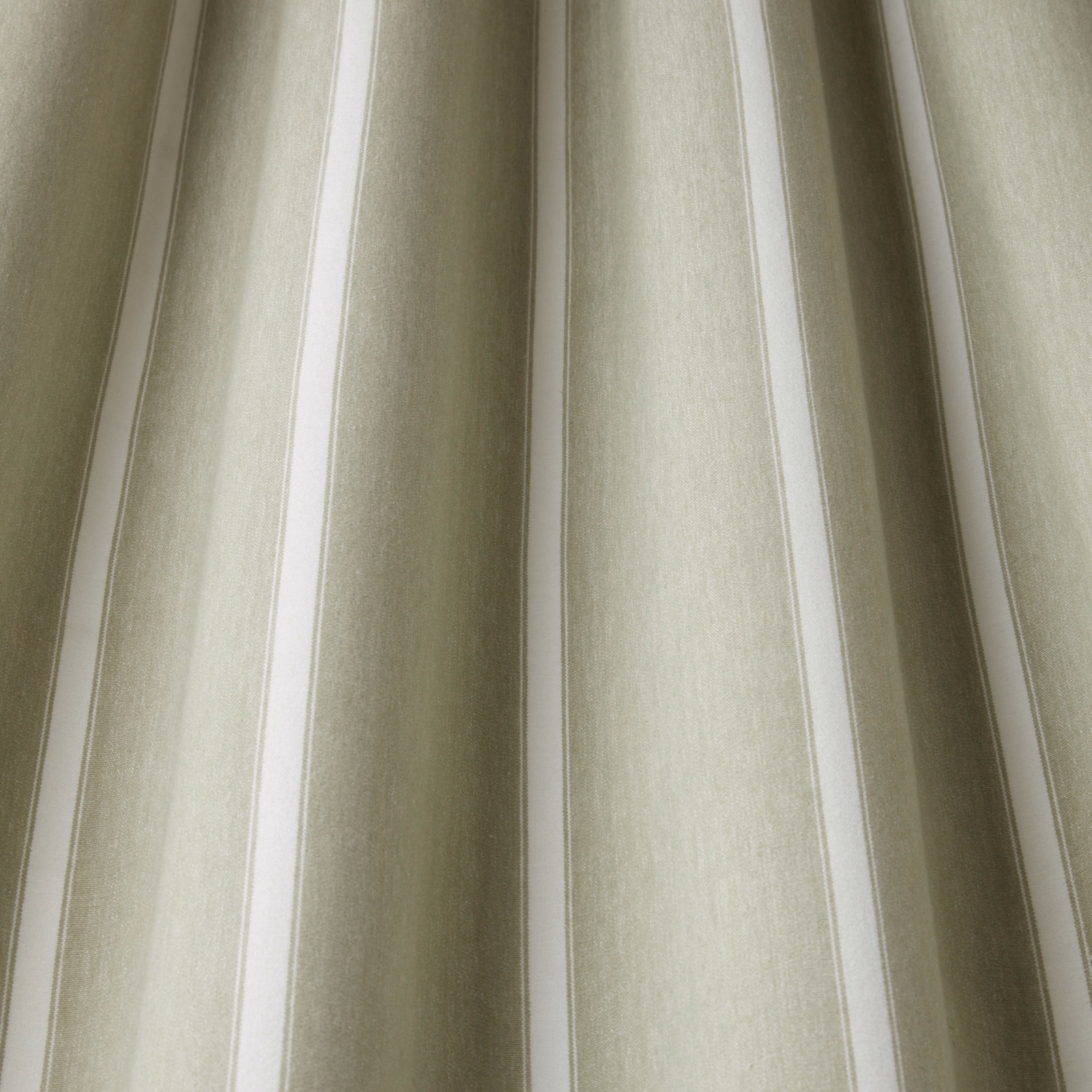 Soft willow green and pale neutral wavy stripes on woven cotton fabric