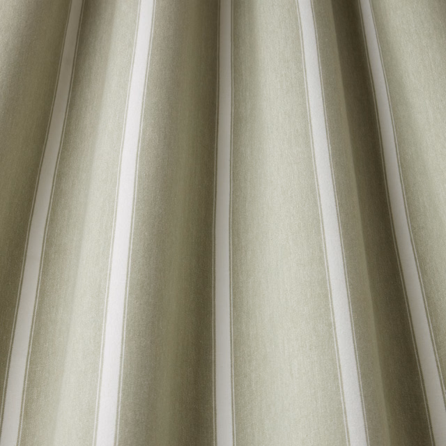 Soft willow green and pale neutral wavy stripes on woven cotton fabric