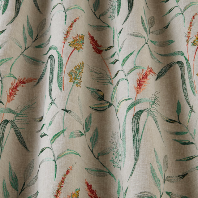 Beige cotton fabric with embroidered green meadow stems and clementine-red floral accents