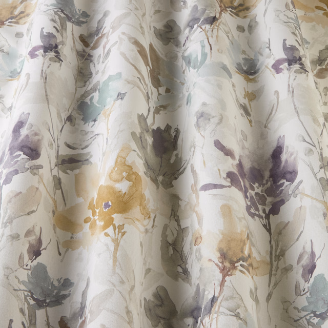 Pale cotton fabric with large painterly floral stems in cornflower, lilac, sage and gold