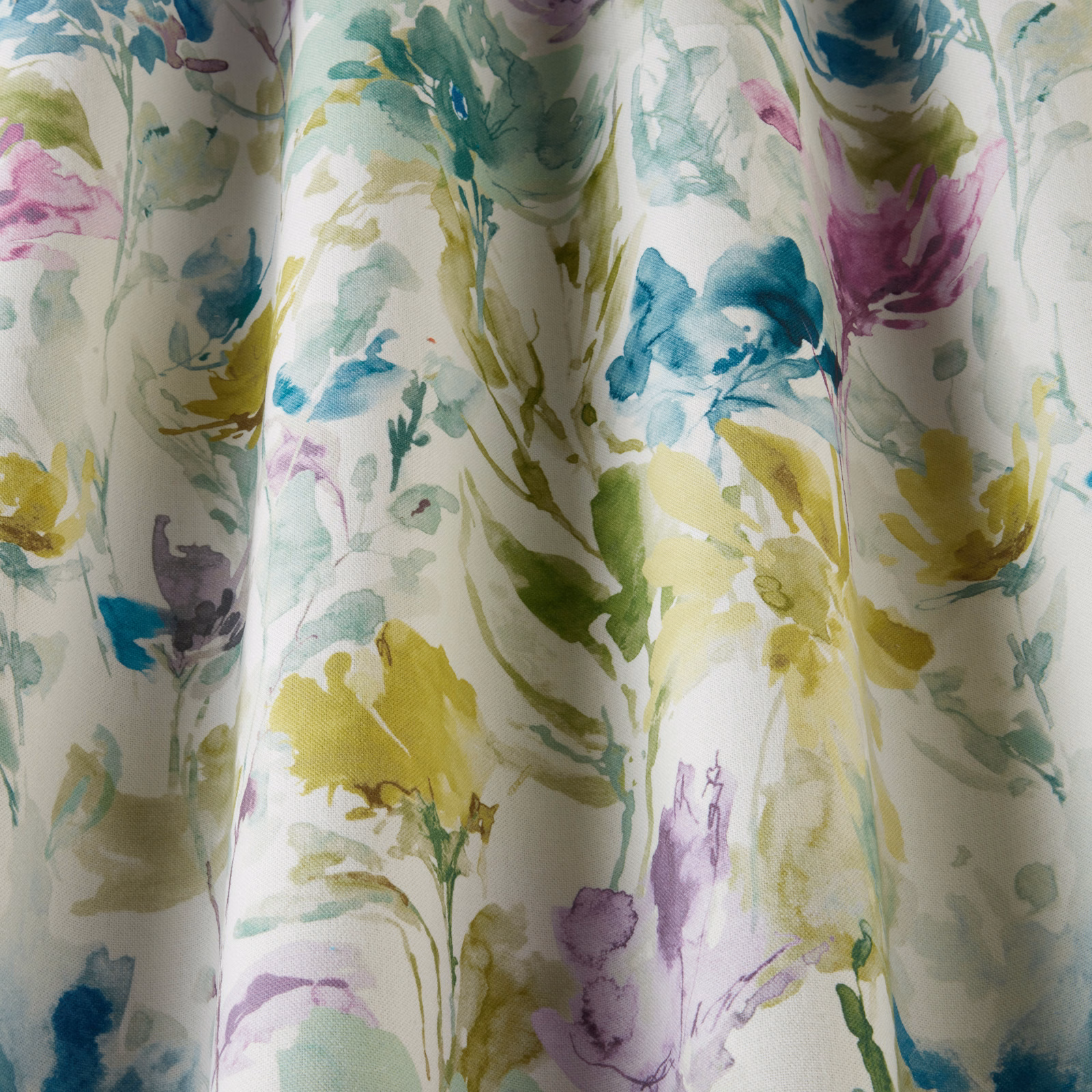 Painterly floral cotton fabric in jade, aqua, yellow and lilac on a white ground