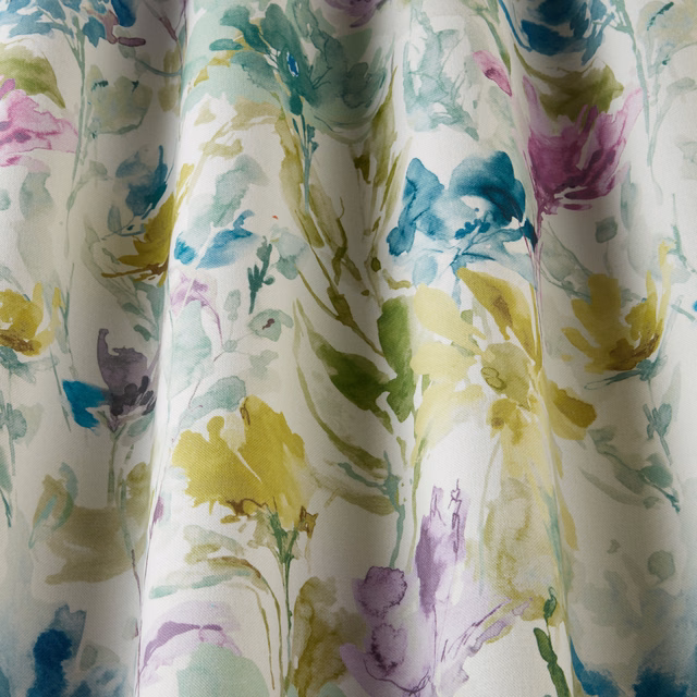 Painterly floral cotton fabric in jade, aqua, yellow and lilac on a white ground