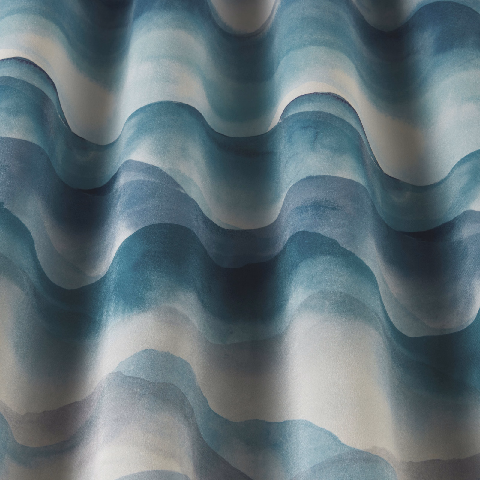 Layered cobalt, aqua and pale cream wavy fabric with soft painterly bands