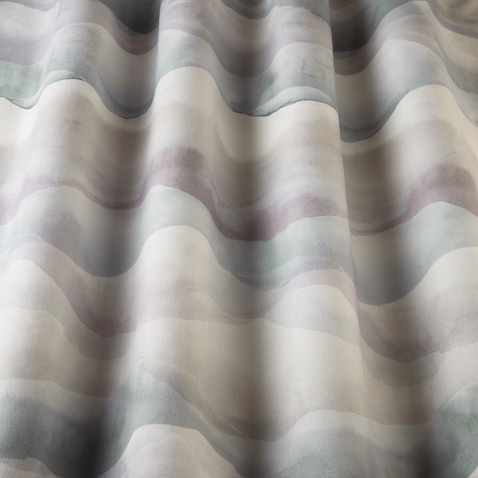 Cream cotton fabric with soft wavy bands in cornflower blue, grey and lilac