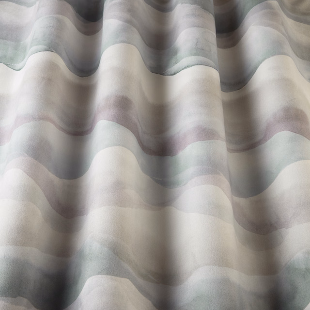 Cream cotton fabric with soft wavy bands in cornflower blue, grey and lilac