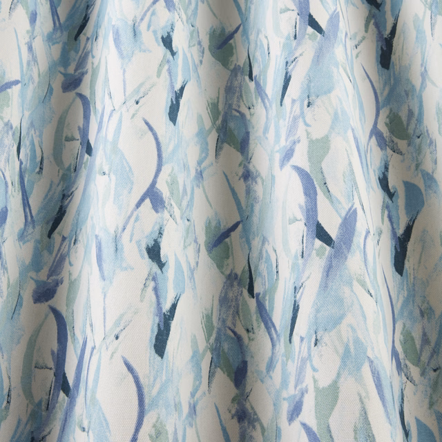 Abstract cotton fabric with cobalt, aqua and soft green brushstrokes on ivory