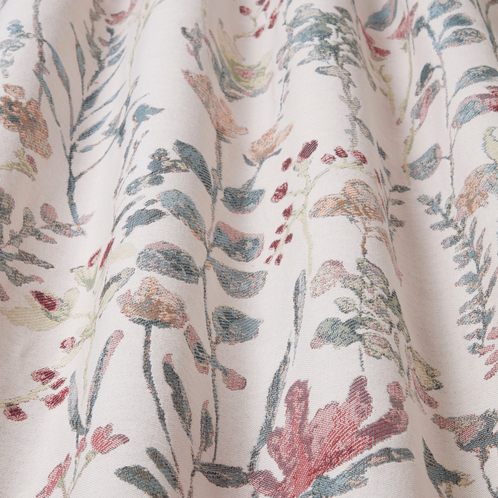 Cream cotton fabric with trailing eucalyptus green and blush botanical print