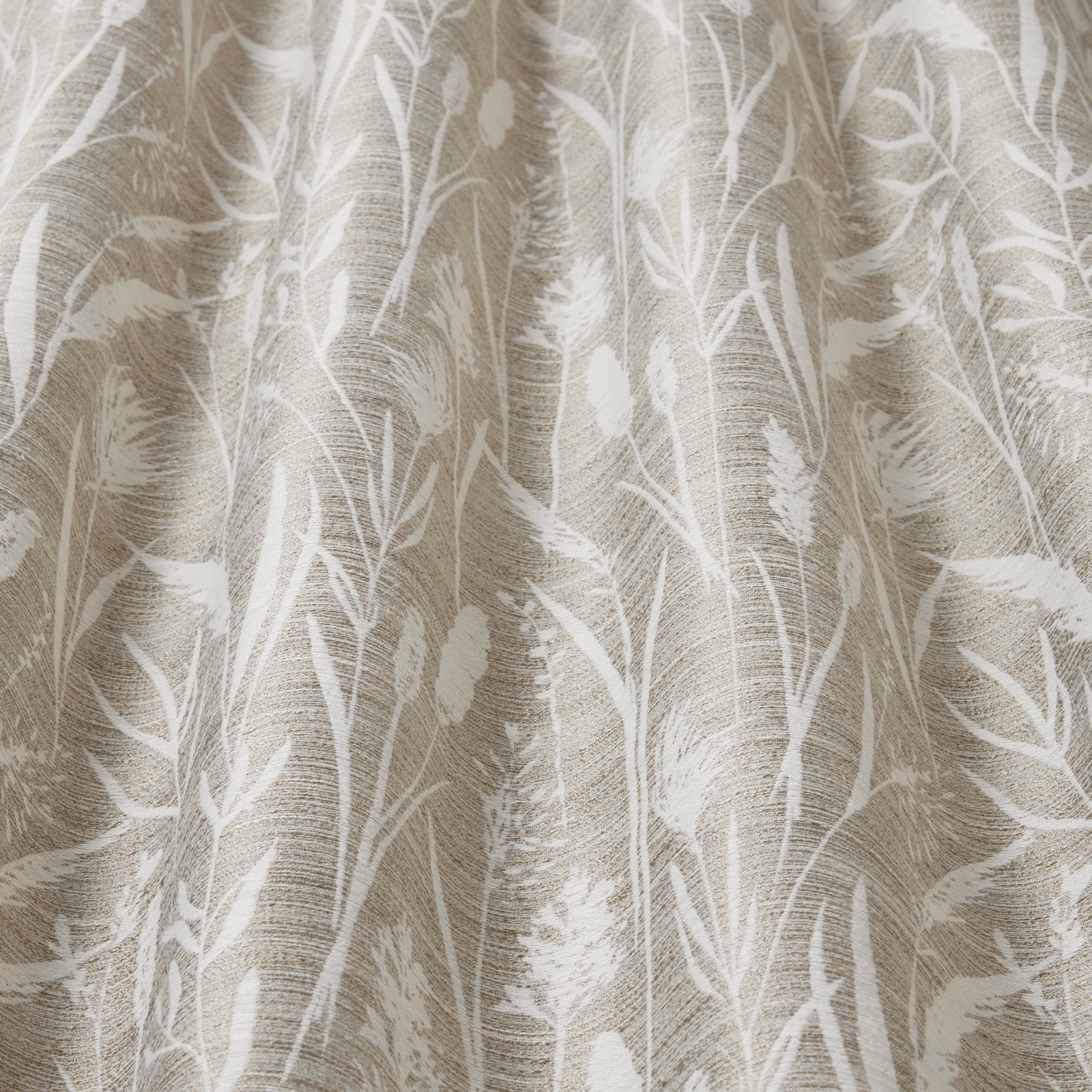 Beige cotton fabric with pale wavy grasses and leaf stems