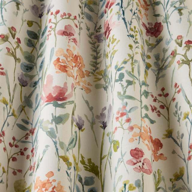 Painterly wildflower cotton fabric with clementine, blush and sage stems on cream