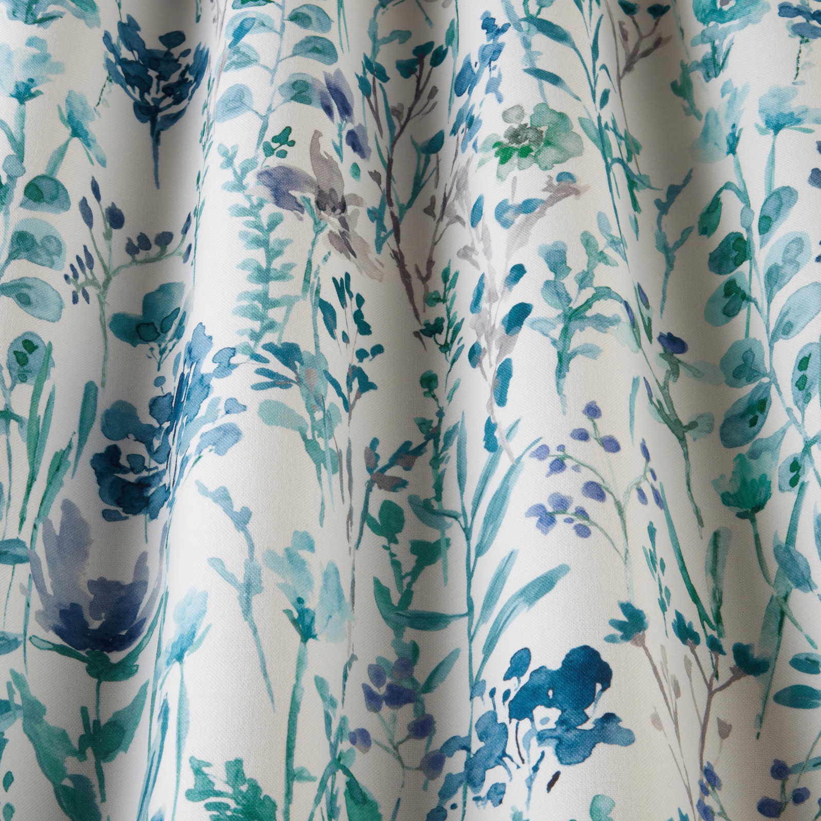 Cobalt and teal wildflower print on ivory cotton with a flowing botanical repeat