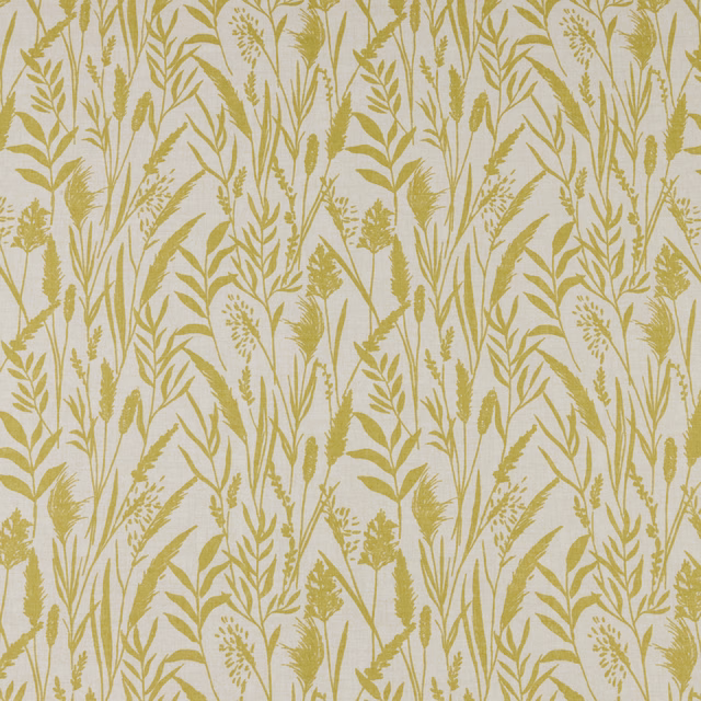 Citrus yellow wild grasses print on a pale cotton ground