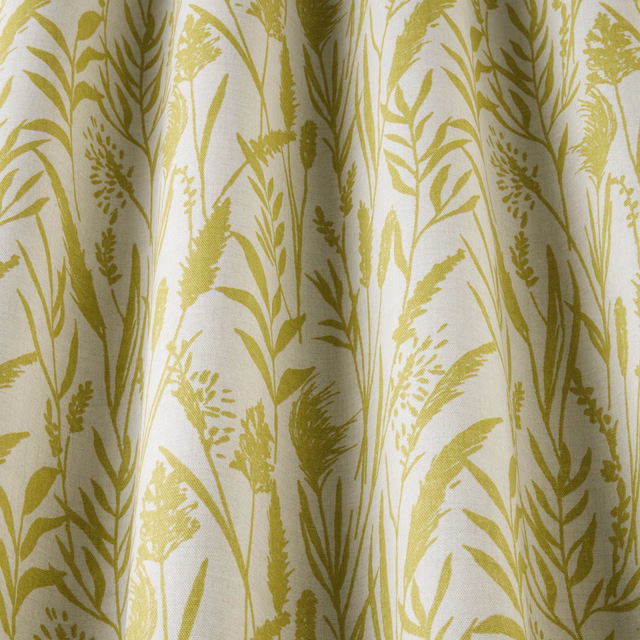 Citrus yellow wild grass botanical print on pale cotton fabric with soft drape