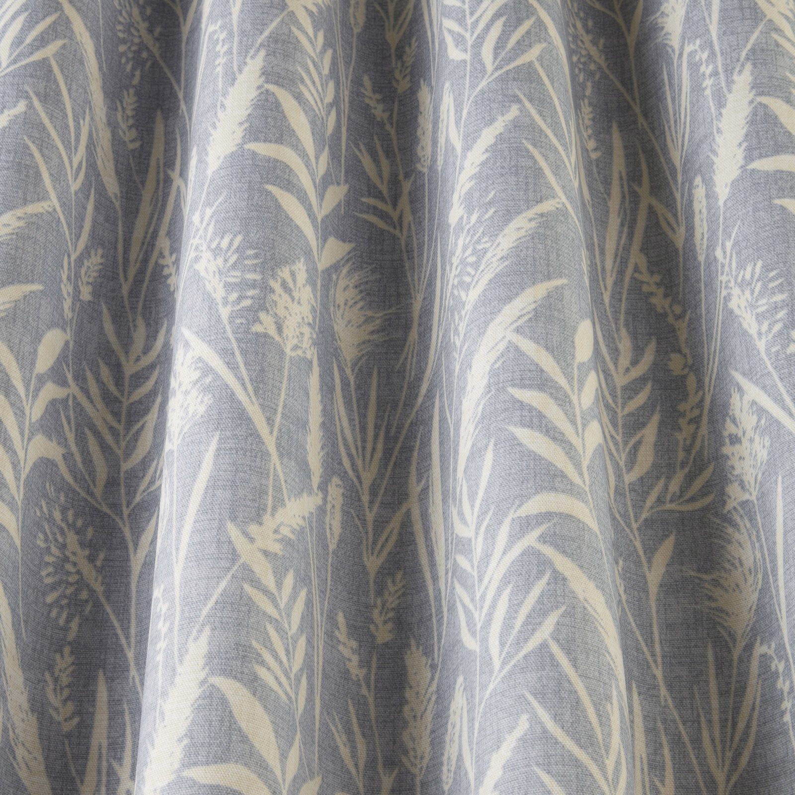 Soft cornflower blue cotton fabric with pale wild grass print