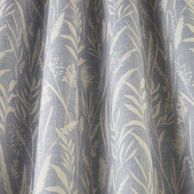 Soft cornflower blue cotton fabric with pale wild grass print