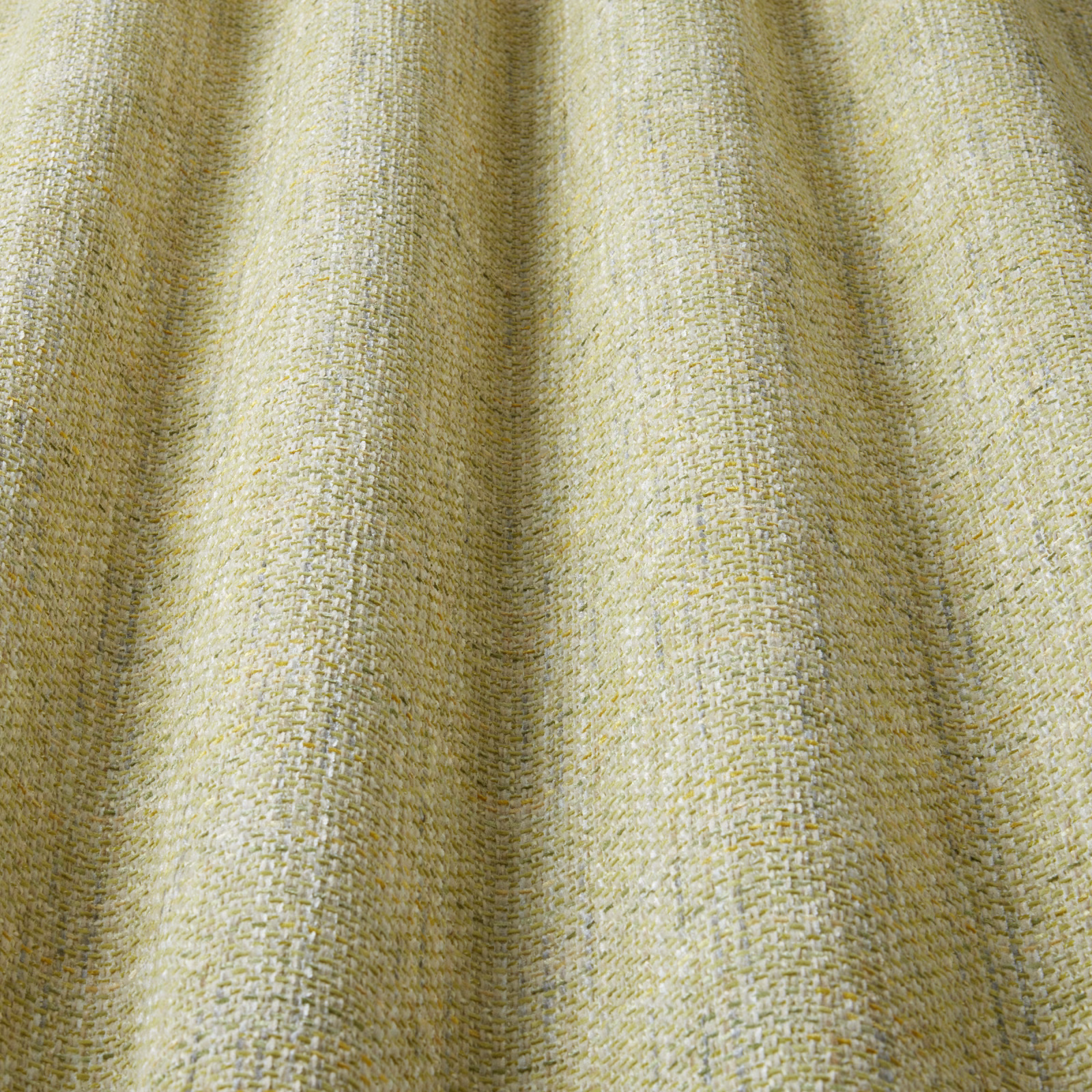 Pale citrus yellow woven cotton fabric with a soft wavy texture