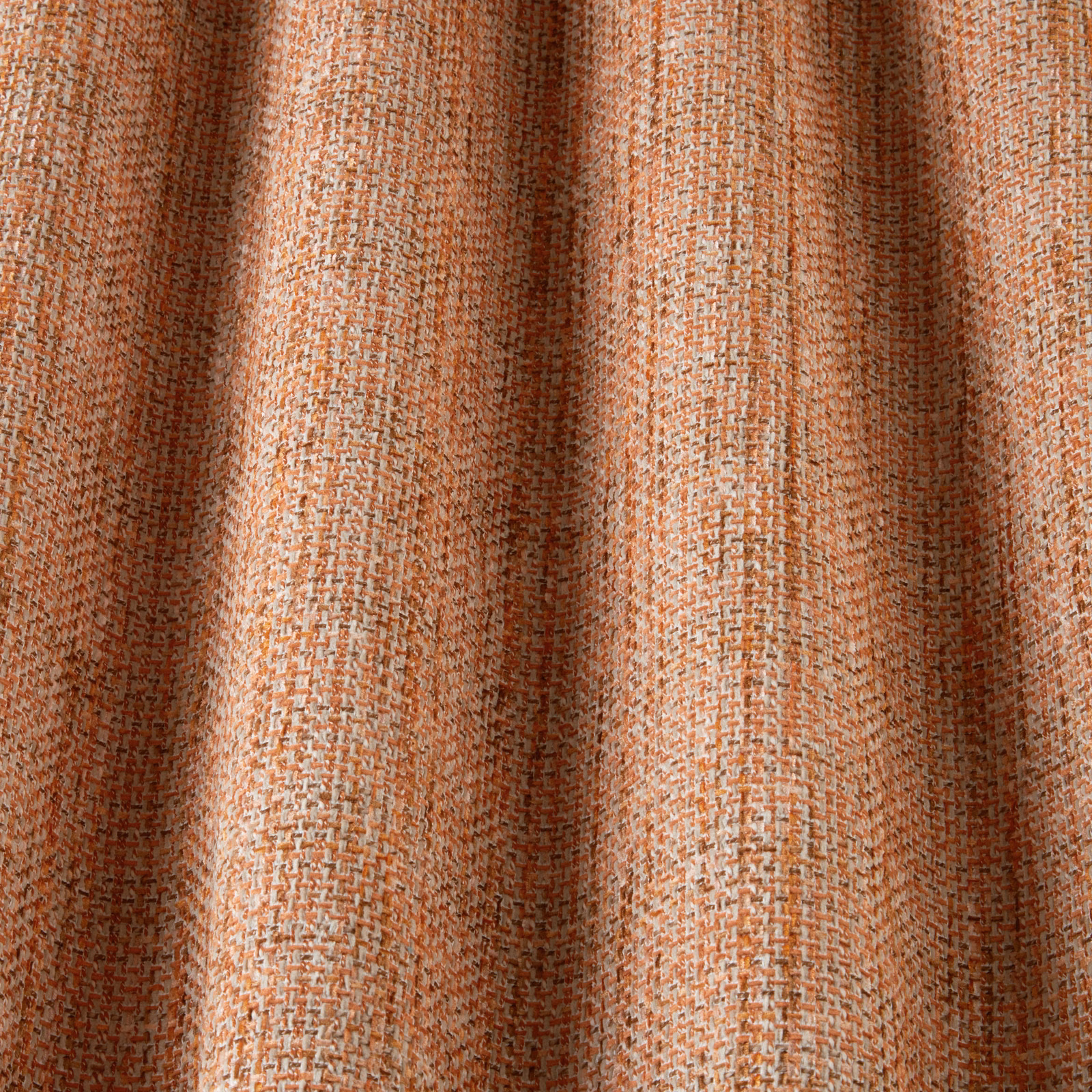 Close-up of clementine orange woven cotton fabric with a wavy textured pattern