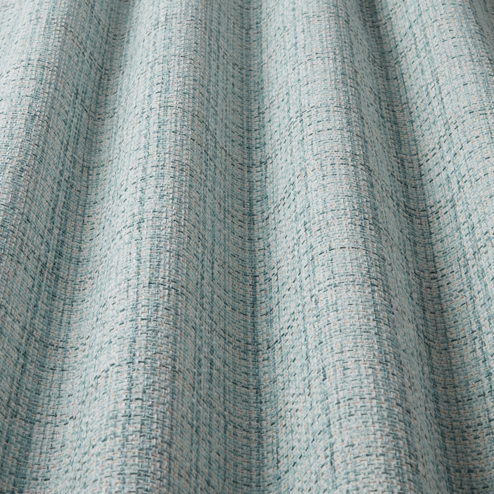 Pale cornflower blue woven fabric with a soft wavy stripe texture