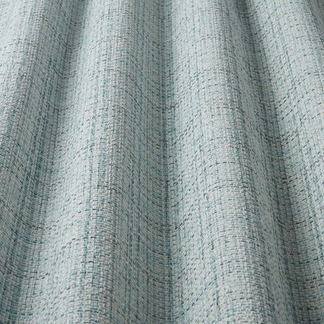 Pale cornflower blue woven fabric with a soft wavy stripe texture