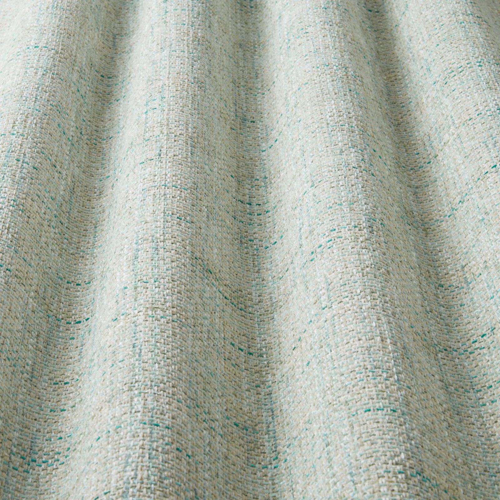 Close-up of eucalyptus green woven fabric with wavy vertical texture