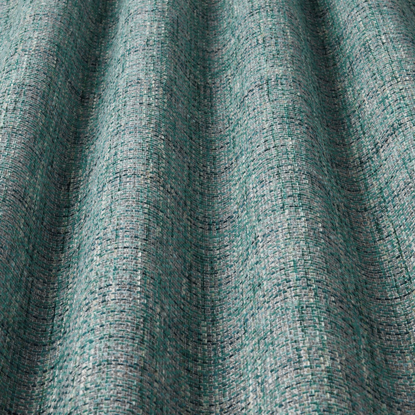 Textured jade green woven fabric with rippled wave pattern and pale highlights