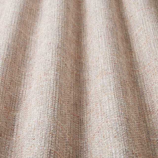Close-up of a soft rosewood and beige wavy textured cotton fabric
