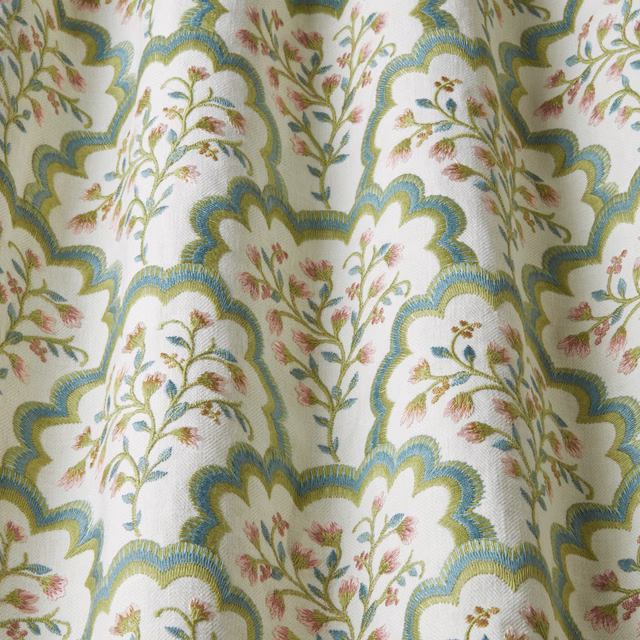 Embroidered scalloped floral fabric in blue-green, sage and orchid pink